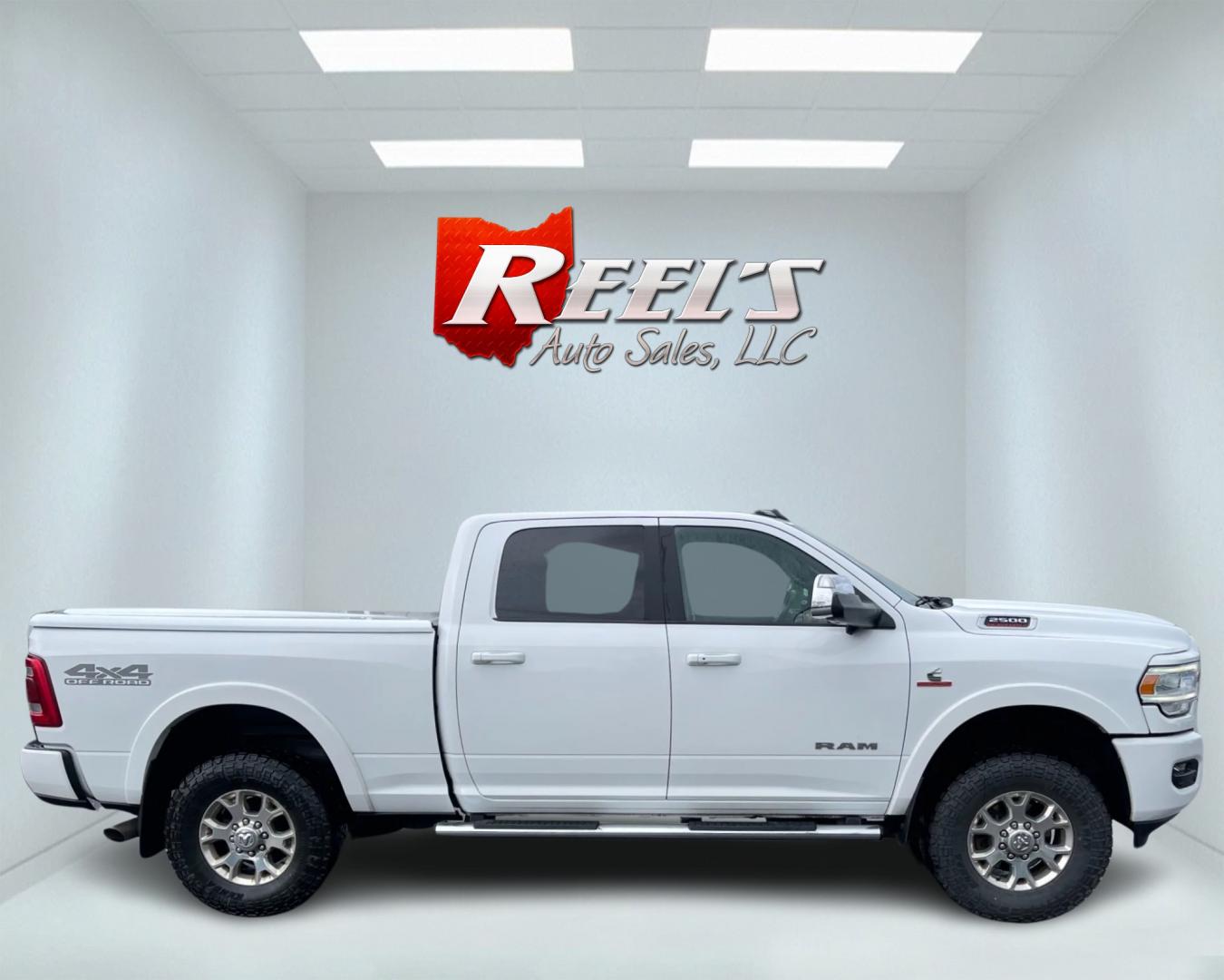 2020 White /Black RAM 2500 Laramie Crew Cab SWB 4WD (3C6UR5FL7LG) with an 6.7L I6 OHV 24V TURBO DIESEL engine, 6A transmission, located at 11115 Chardon Rd. , Chardon, OH, 44024, (440) 214-9705, 41.580246, -81.241943 - This 2020 Ram 2500 Laramie Crew Cab is a powerhouse pickup truck designed for serious towing and hauling capabilities. Under the hood lies a 6.7L Cummins Turbo Diesel engine mated to a 6-speed 68RFE transmission with 3.73 gearing, producing an impressive 370 hp and a staggering 850 lb-ft of torque. - Photo#3